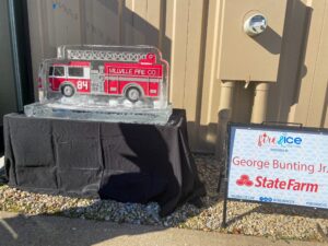 a ice sculpture of a fire truck and state farm sign