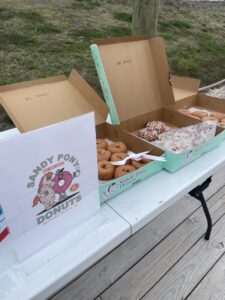two boxes of donuts are on a table