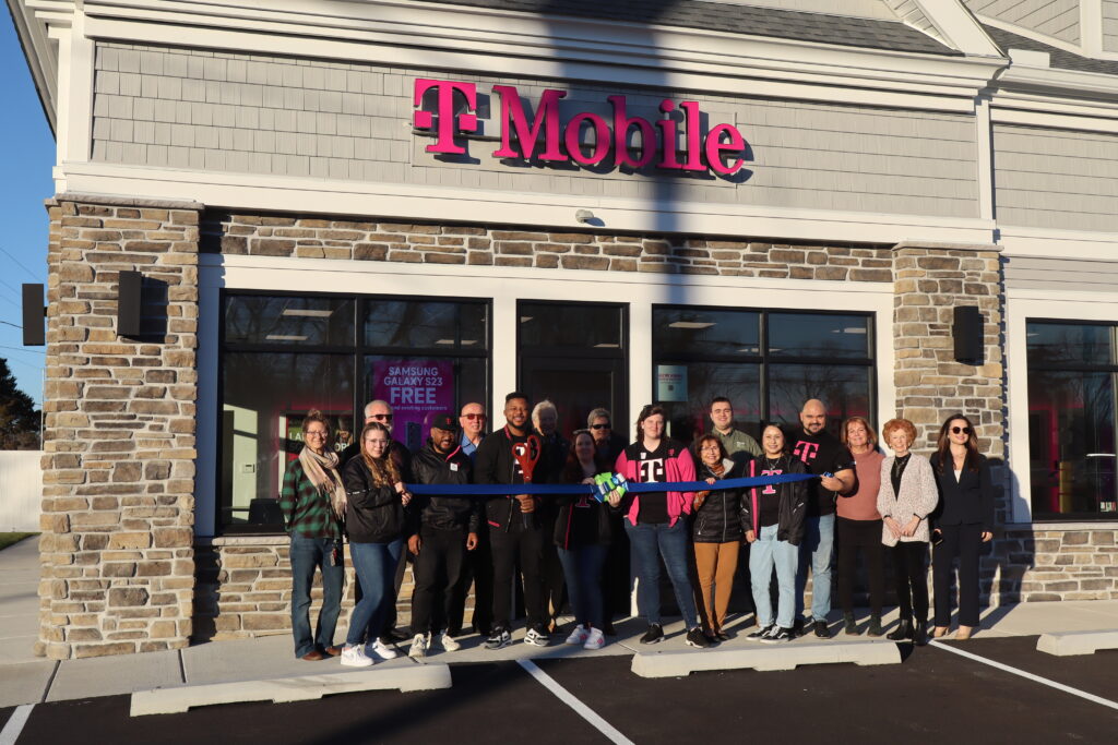 a group of people standing in front of a store