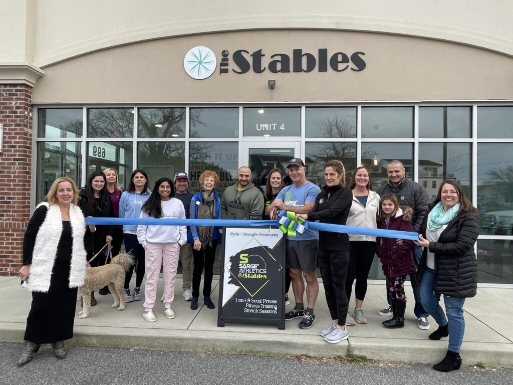 a group of people standing in front of a store