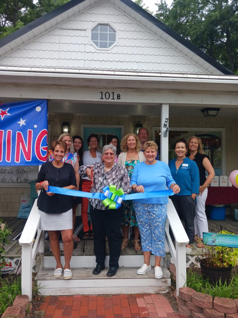 a group of people standing outside of a house