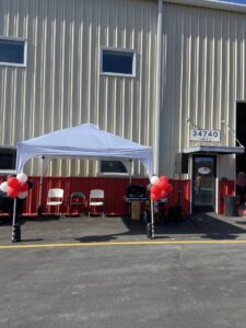 a building with red and white balloons in front of it