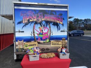 a food truck with a sign on the side of it